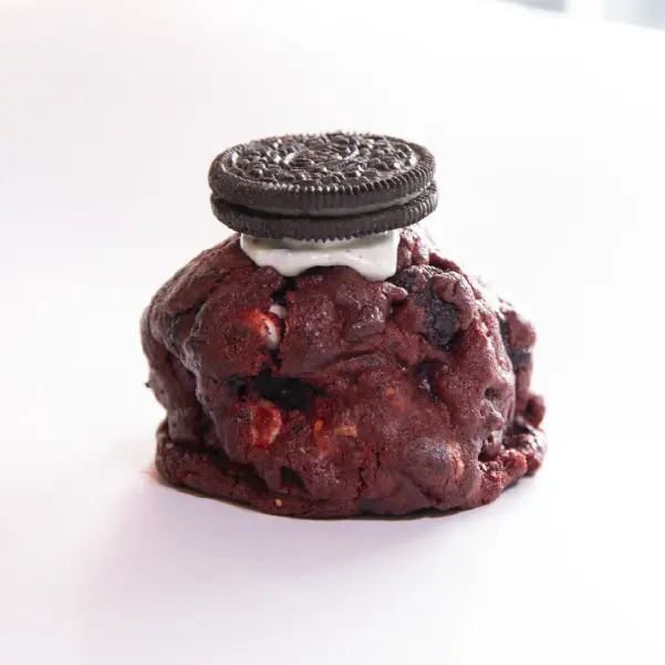 Queen Velvet Cookie with cream cheese, chocolate chips, and Oreos
